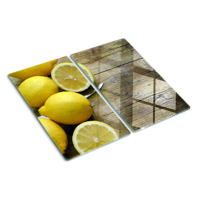 Steklena podloga za rezanje Limone na lesenem ozadju