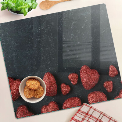 Steklena podloga za rezanje Rdeča srca na temnem ozadju