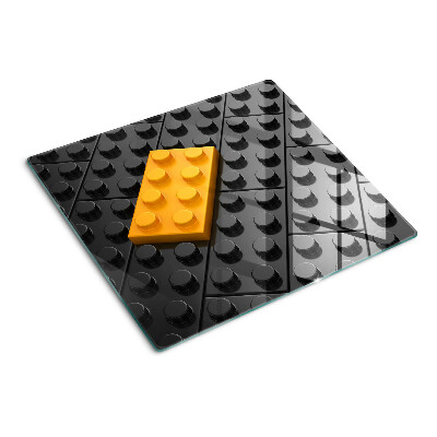Steklena podloga za rezanje LEGO kocke na črnem ozadju