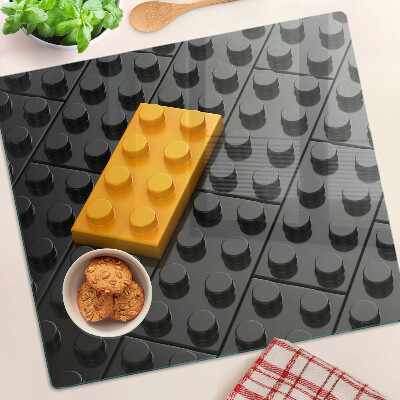 Steklena podloga za rezanje LEGO kocke na črnem ozadju