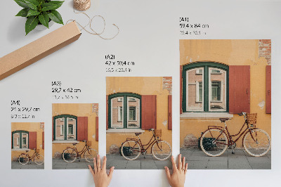 Plakat Kolo na ozadju pisane retro fasade