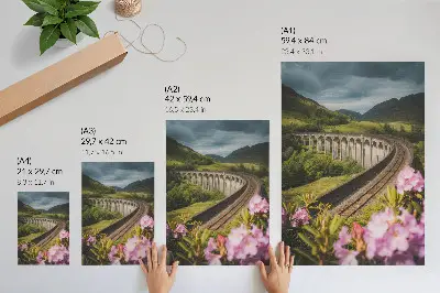 Plakat za dnevno sobo kamniti viadukt med zelenimi griči s pastelnimi rožami