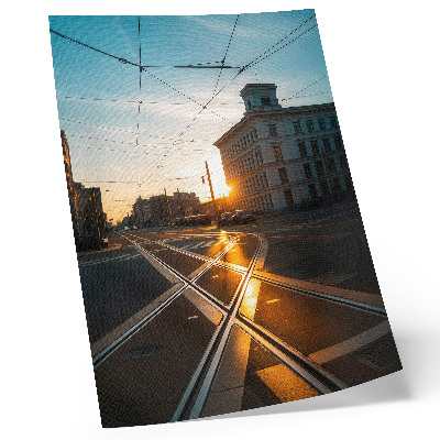 Umetniški tisk na platno Zahajajoče sonce nad mestom z arhitekturo