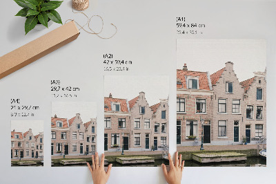 Premium stenski plakat Opečne stanovanjske hiše z rdečimi strešniki