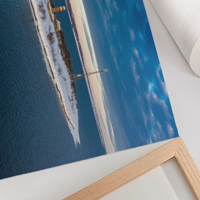 Plakat Zimski otok s svetilnikom in modrim morjem