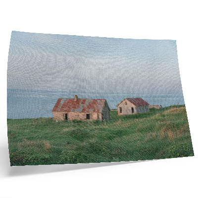 Plakat s teksturo platna Rustikalne stavbe zeleni travniki morje