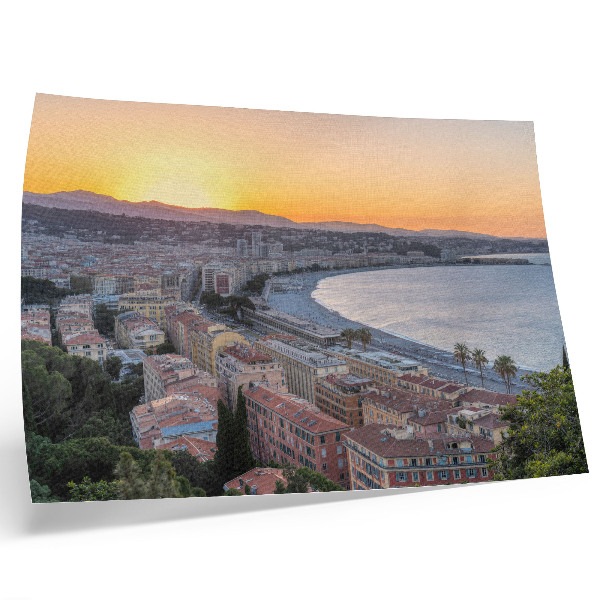 Plakat Pogled na mesto ob sončnem zahodu nad morjem