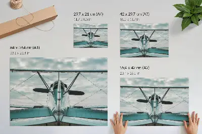 Plakat s teksturo platna pogled od spredaj na dvokrilno letalo v slogu industrijske elegance